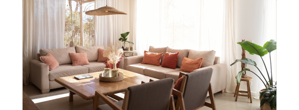 A living room with two sofas and two chairs