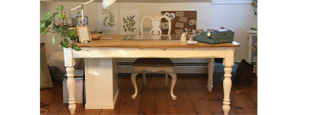 White desk with wood top and chair.