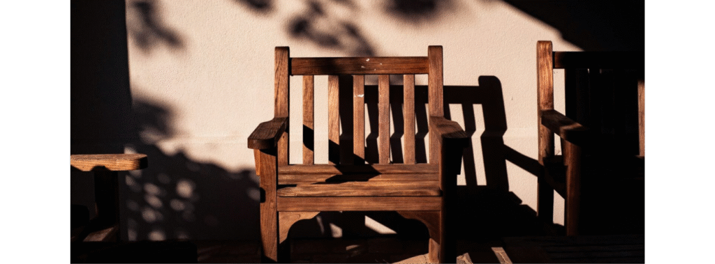 Brown outdoor chair sitting under the sun.
