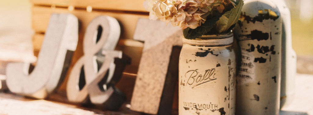 Painted mason jar with flowers and large craft letters